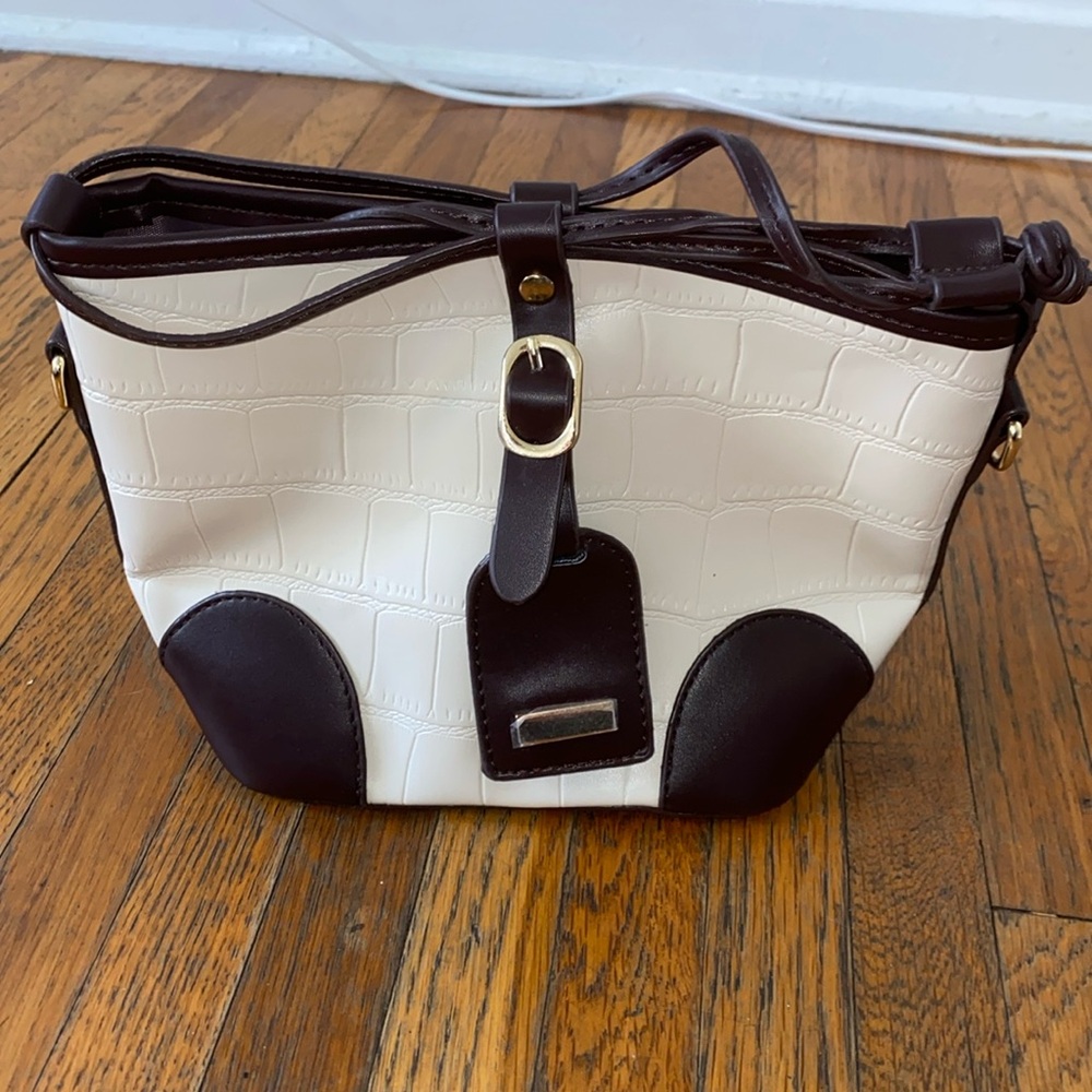 Cross body white small bucket purse. White and brown purse.